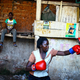 A female boxer trains inside a makeshift gym in Katanga, Kampala, Uganda.